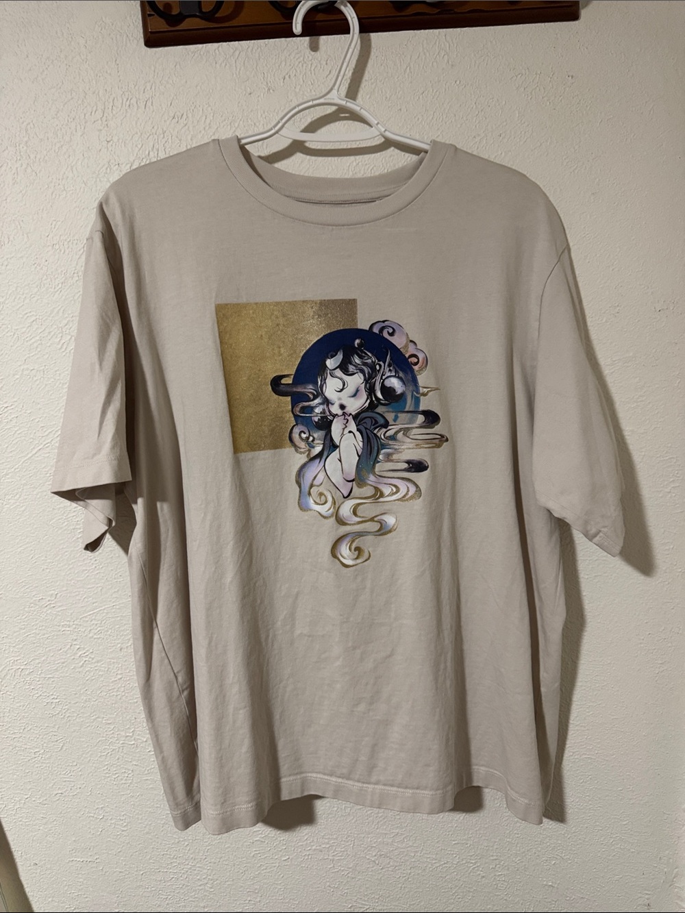 Uniqlo Cream Kids Graphic Tee with Gold Square and Blue Accent